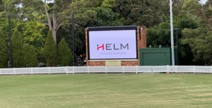 Allan Border Oval new scoreboard with HELM sign on it